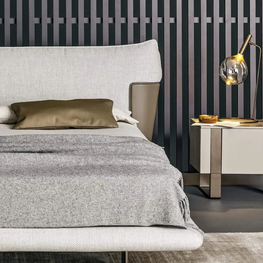 Harmonious Bonaldo Blend bed with padded headboard in textured light fabric and emery leather accents