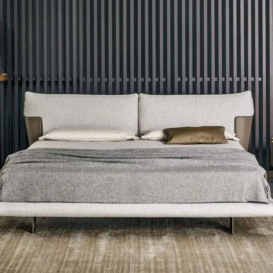 Sophisticated Bonaldo Blend bed with light gray textile upholstery and emery leather headboard inserts with slender matt painted metal legs