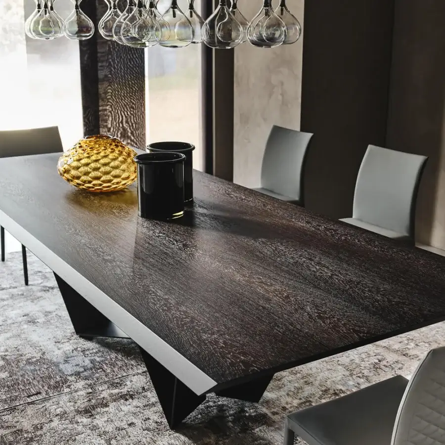 Distinguished Cattelan Italia Skorpio Wood table with a barrel top in Canaletto walnut and black embossed lacquered steel base