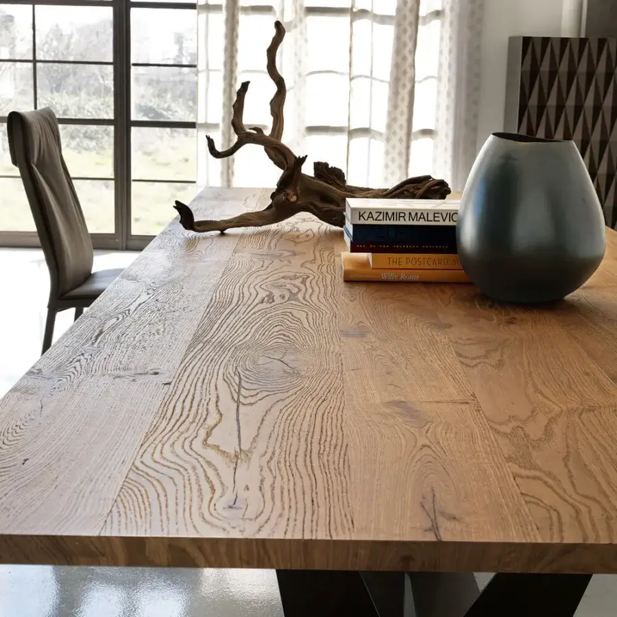 Distinguished Cattelan Italia Skorpio Wood table with warm medium brown burned oak top and dark embossed lacquered steel base in a geometric V-shape