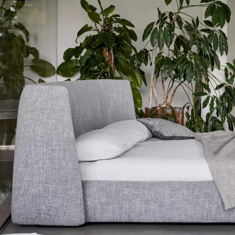 Lavish Bonaldo Basket bed with enveloping lines and textured grey textile upholstery built with anthracite painted wood feet