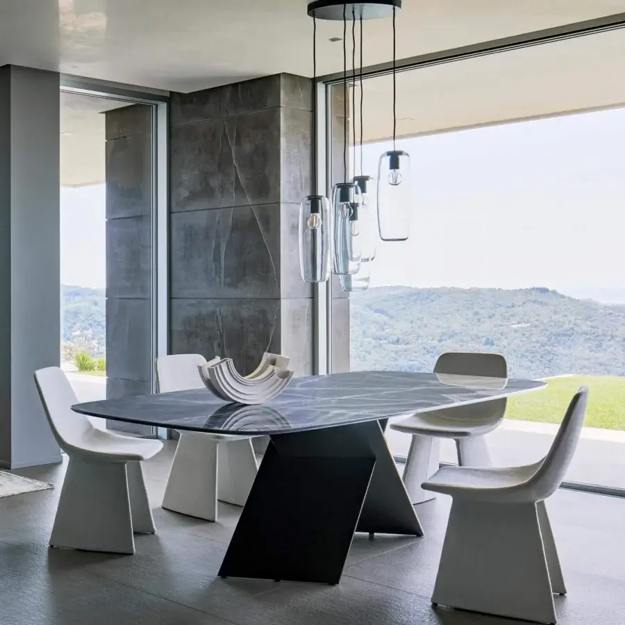 Distinguished Bonaldo AX table with dark gray glossy ceramic top exhibiting lighter veining and burnished geometric base