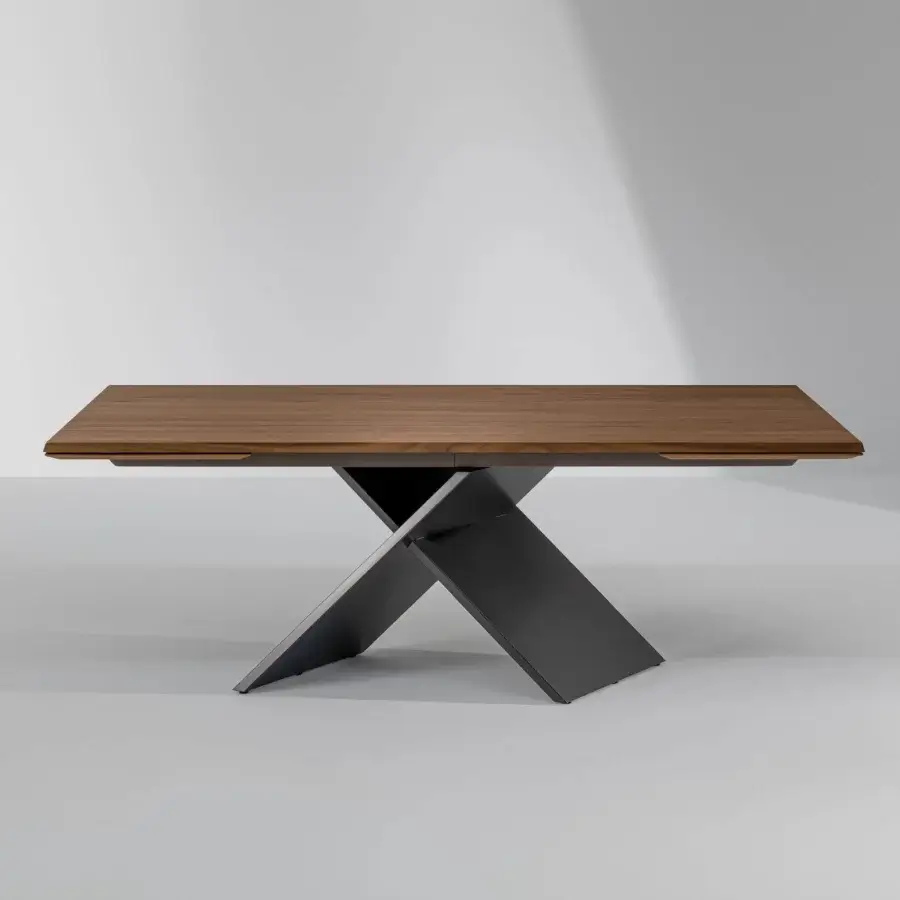 Exclusive Bonaldo AX table with medium brown wooden top and dark gray painted metal X base exhibiting extendable function