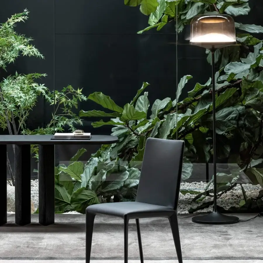 Elegant Bonaldo Filly chair with smooth dark gray fabric upholstery and slim dark gray metal legs