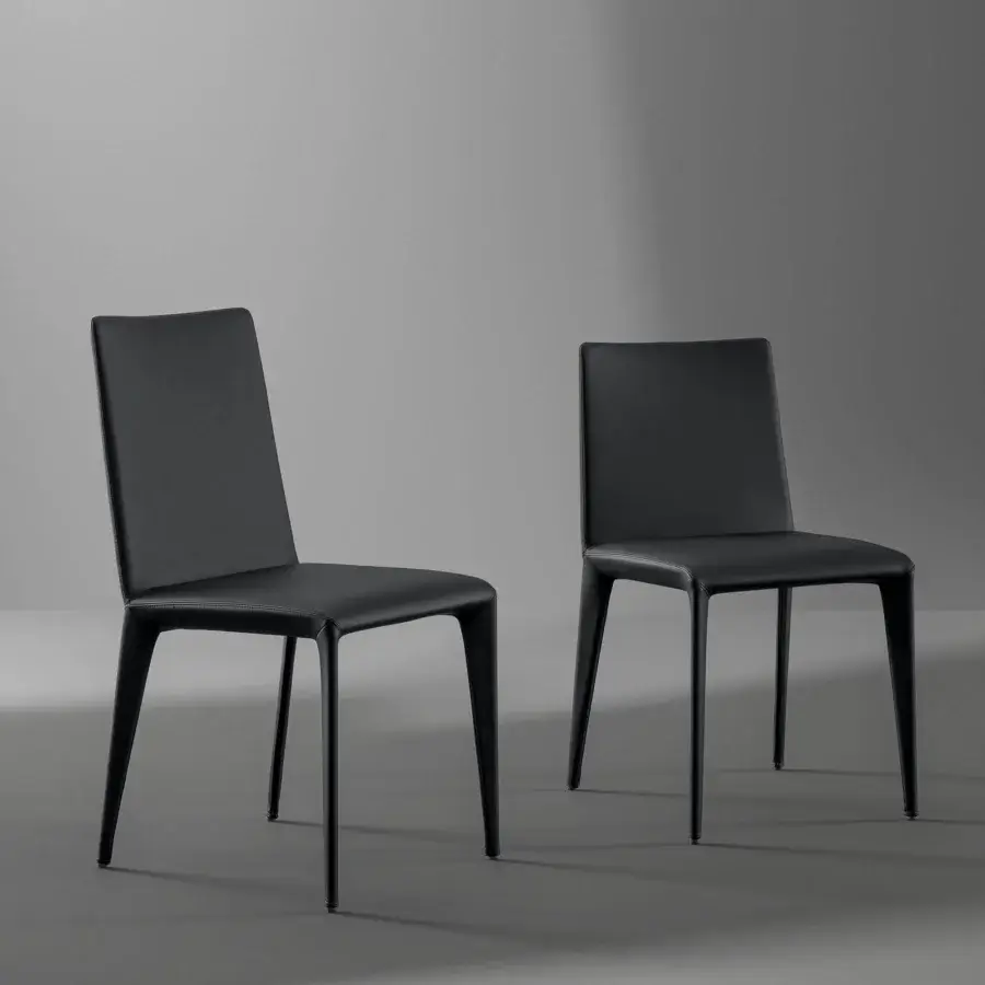 Superior Bonaldo Filly chair upholstered in black eco-leather with a smooth matte finish and slim metal legs