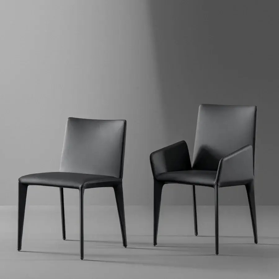 Elegant Bonaldo Filly chair upholstered in sleek black eco-leather with tapered metal legs crafted in Italy
