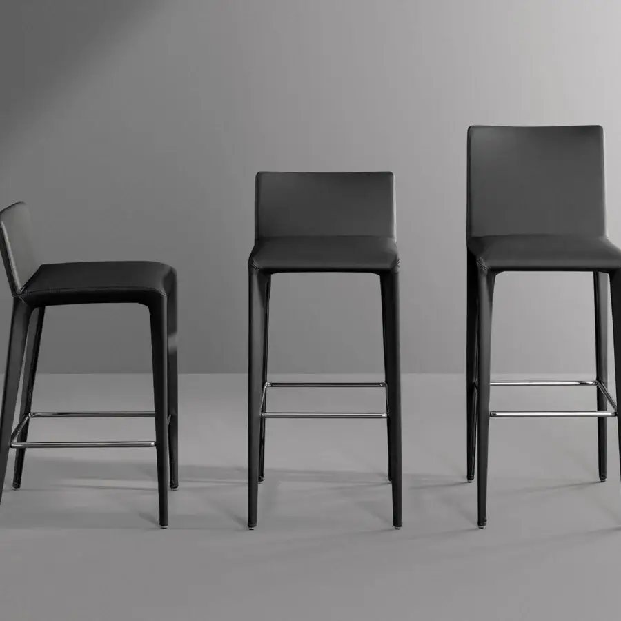Elegant Bonaldo Filly Too stool in black eco-leather with visible metal legs and chromed footrest