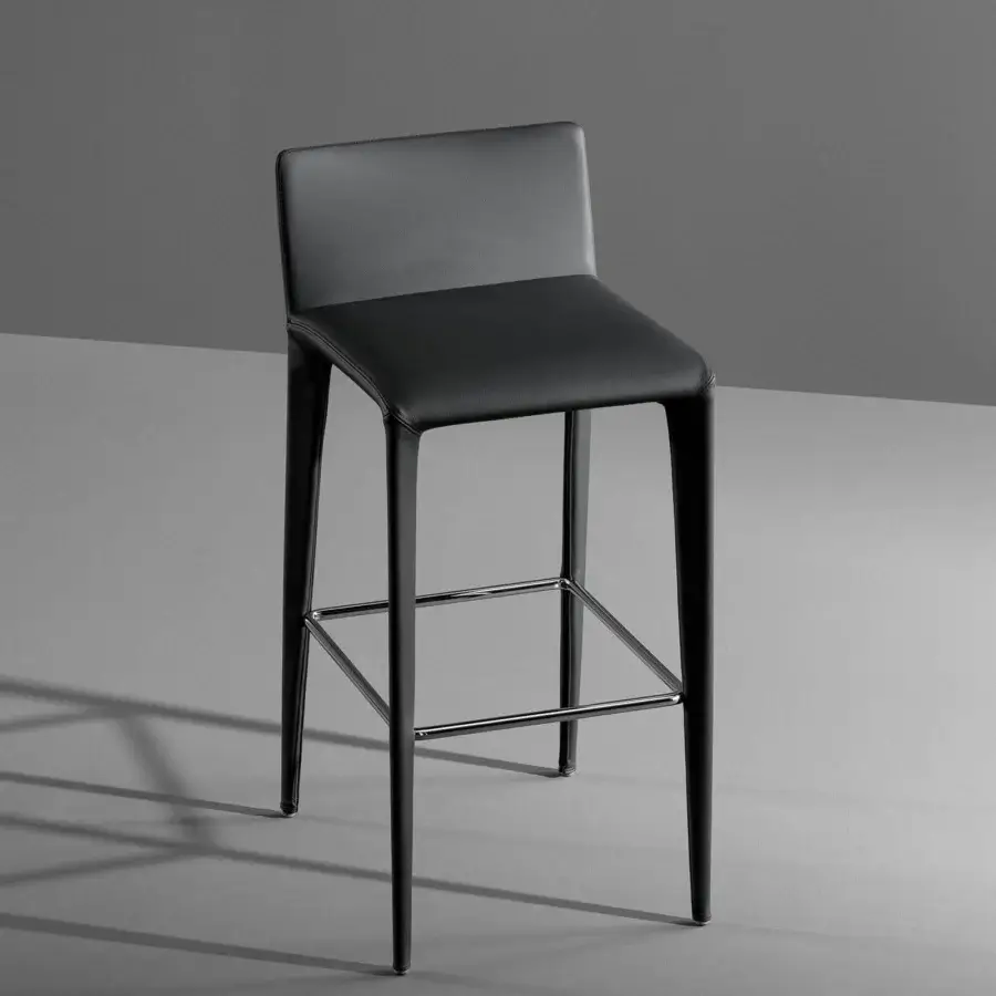 Superior Bonaldo Filly Too stool upholstered in black eco-leather with a chromed scuff plate footrest and uniform finish