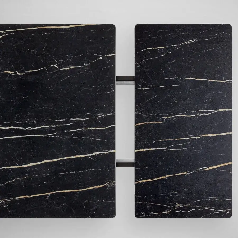 Exceptional Bonaldo Big extendable table with glossy marble-like top and dynamic laser-cut steel legs
