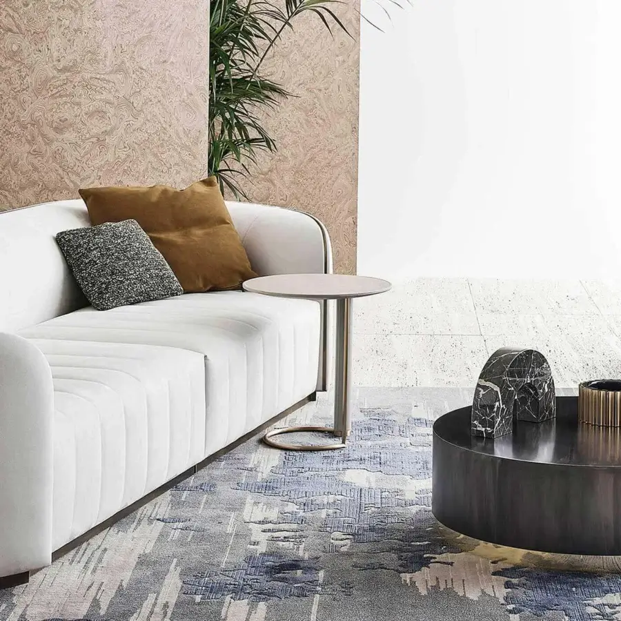 Lavish Rugiano Genesi side table in flamed iron with glossy gold details and a dark smooth surface