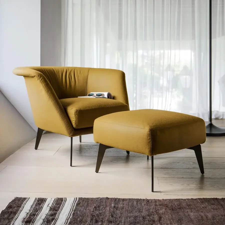 Distinguished Bonaldo Lovy lounge chair in warm mustard yellow fabric with wood and metal legs includes a round ottoman