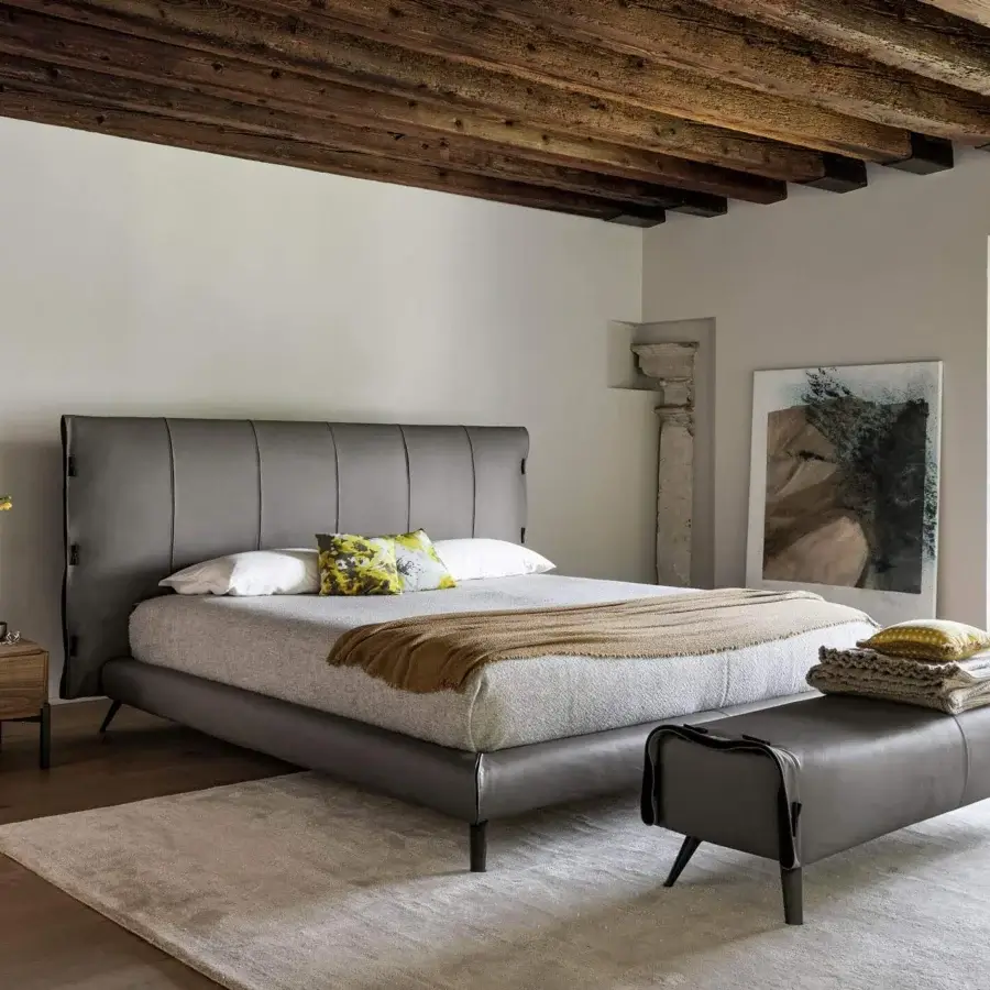 Exceptional Bonaldo Cuff bed with matte gray eco-leather upholstery, vertical headboard panels and slender metal legs