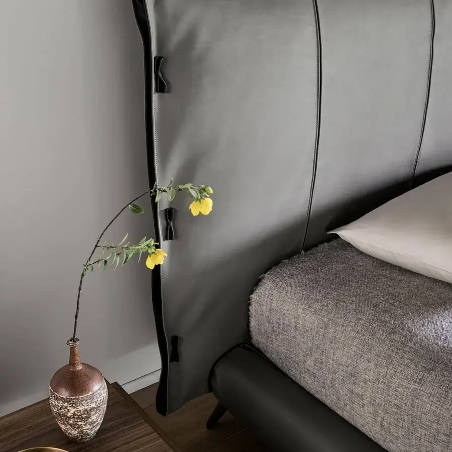 Distinguished Bonaldo Cuff bed with meticulous tailoring, frog fastenings and matte gray leather-like upholstery