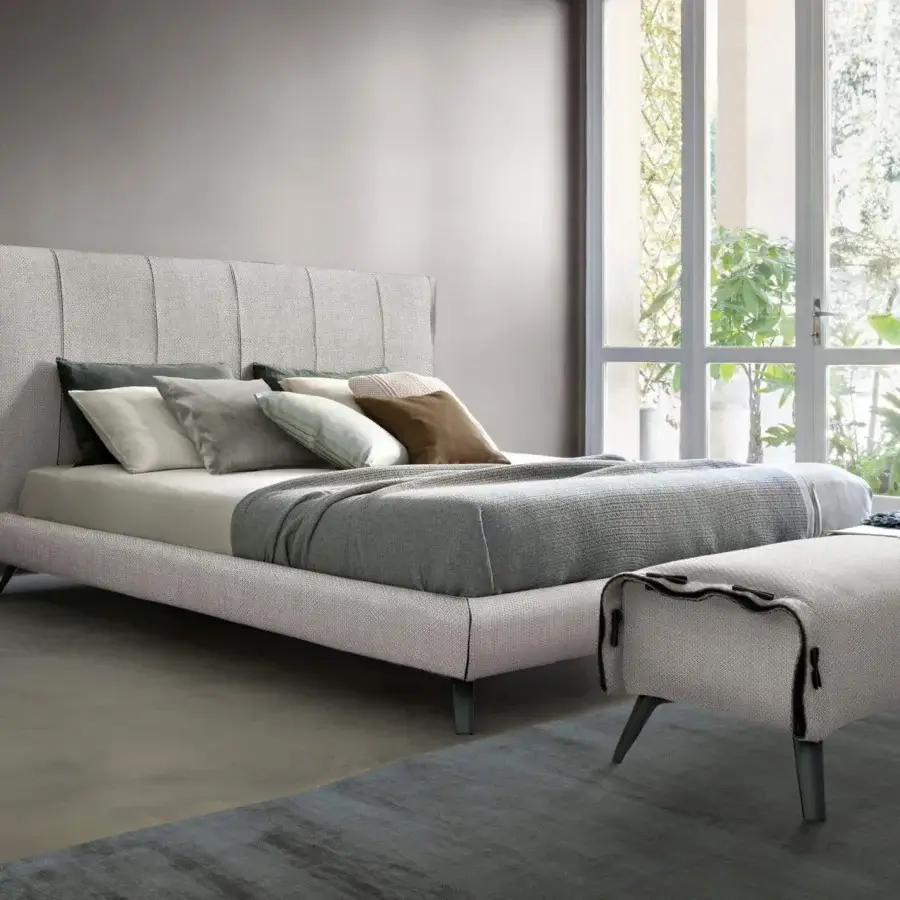 Exclusive Bonaldo Cuff bed with tailored details, woven light gray upholstery and dark trim accents
