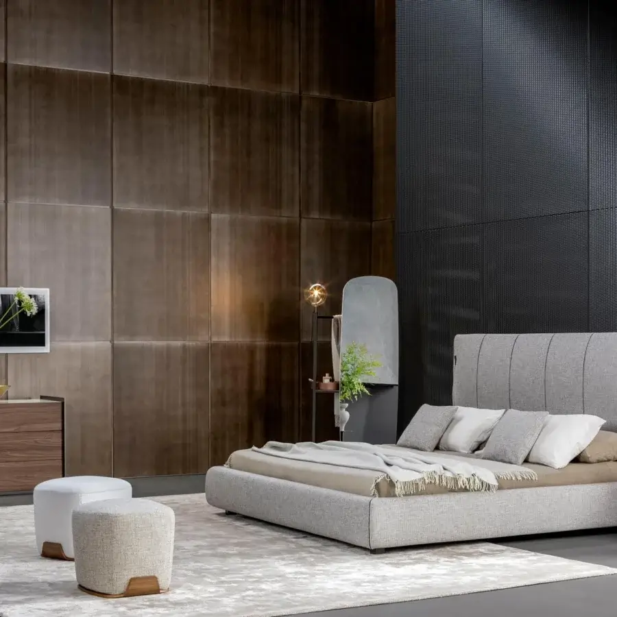 Distinguished Bonaldo Cuff bed with light gray textile upholstery and tailored frog fastenings on a platform frame