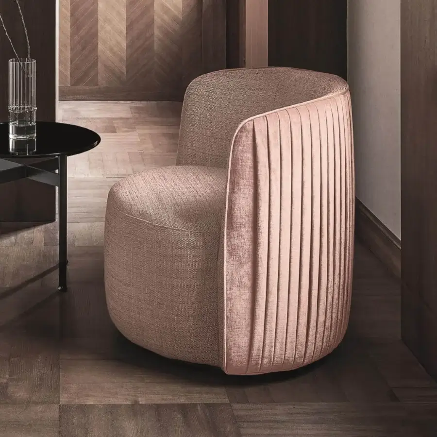 Sophisticated Ditre Italia Chloè lounge chair upholstered in muted mauve textile with vertical pleating on the backrest