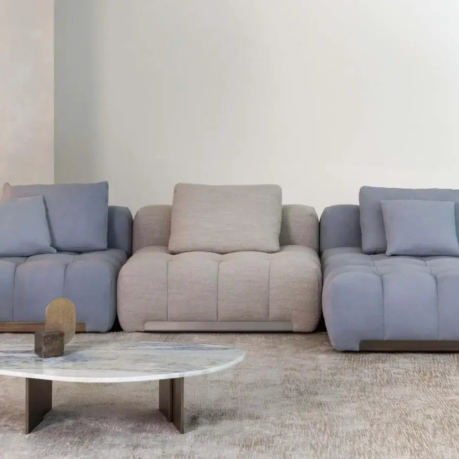 Distinguished Rugiano Yacht sectional with soft lines, geometric forms, light blue and beige fabrics, refined bronze brass details