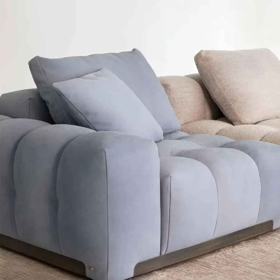 Exceptional Rugiano Yacht sectional with soft lines, geometric silhouette, and dark-toned metal details in light gray textile upholstery