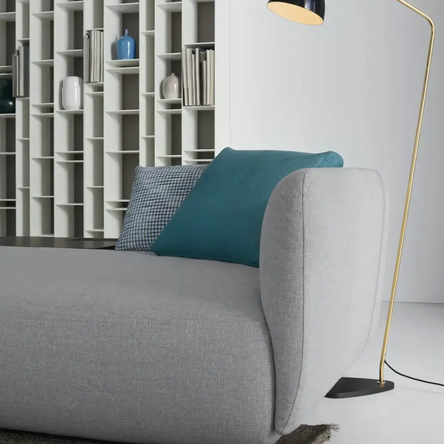 Sophisticated MDF Italia Cosy sectional with light gray textile upholstery and a gently curved, completely removable cover