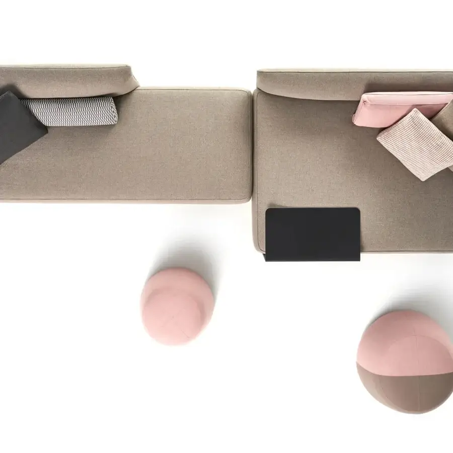 Distinguished MDF Italia Cosy sectional with soft beige textile upholstery, sleek black side table and dual-tone ottomans built for comfort