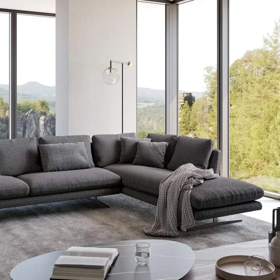 Elegant Bonaldo Lars sectional in uniformly colored gray textile with dark metal base and matching cushions