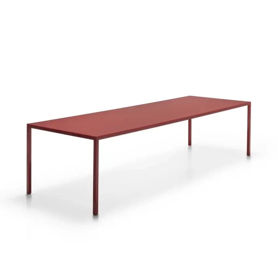 Elegant MDF Italia Tense Material table with rectangular tabletop and slender legs in matt-brushed brass plate and transparent acrylic cover