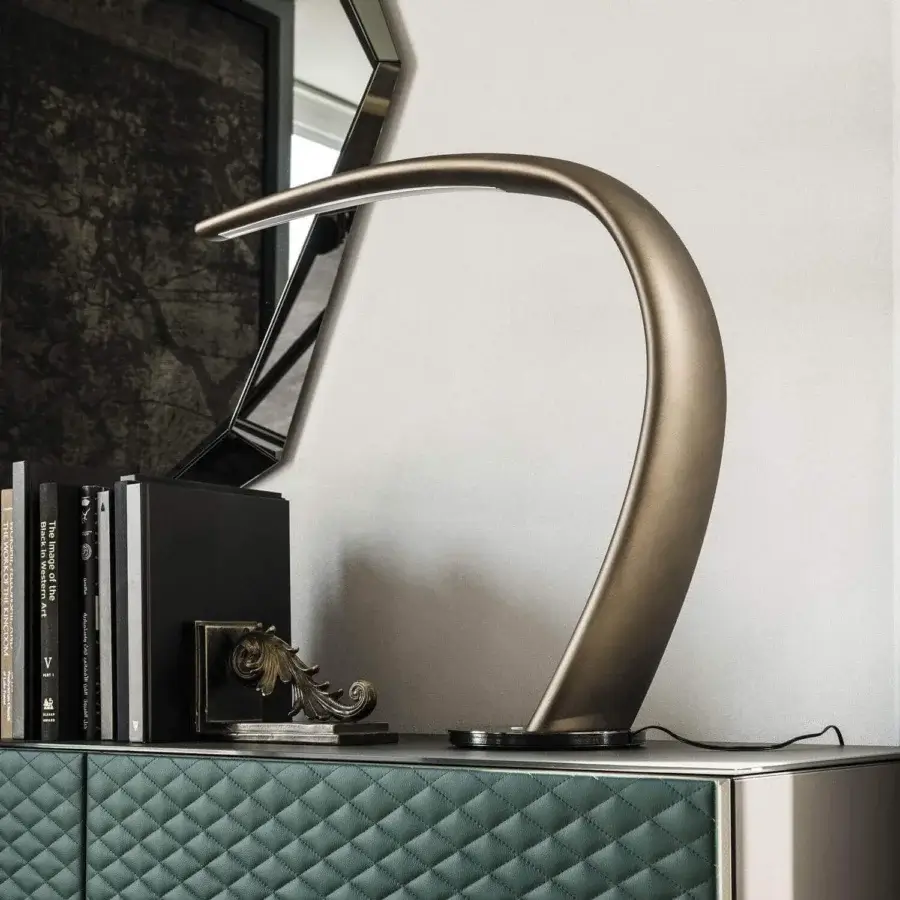 Captivating Cattelan Italia Mamba table lamp in brushed bronze painted rigid polyurethane with black chrome base and satin finish