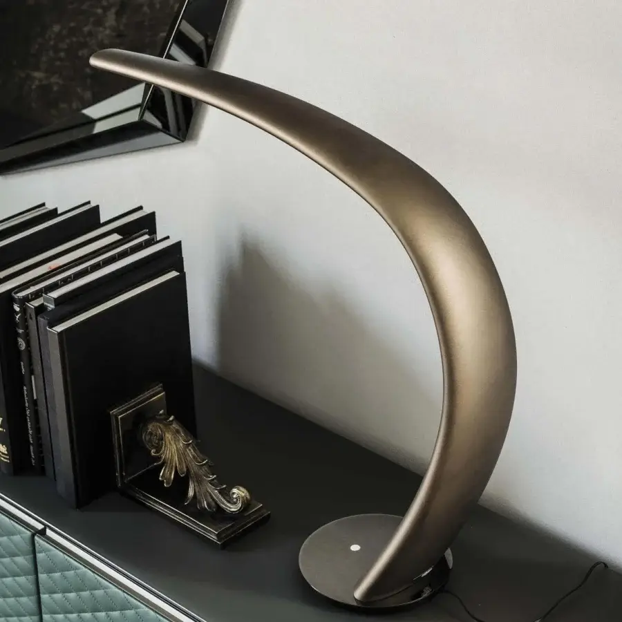 Elegant Cattelan Italia Mamba table lamp crafted in rigid polyurethane with a brushed bronze painted finish and black chrome base
