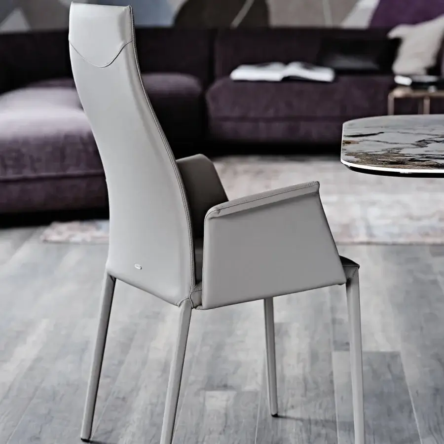 Elegant Cattelan Italia Norma chair in light gray synthetic leather with sleek metal legs and enveloping backrest