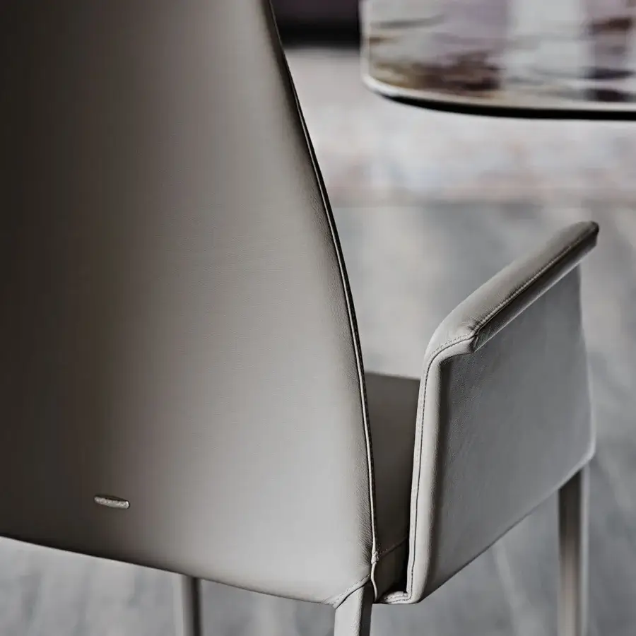 Exceptional Cattelan Italia Norma chair upholstered in sophisticated gray with matte finish materials