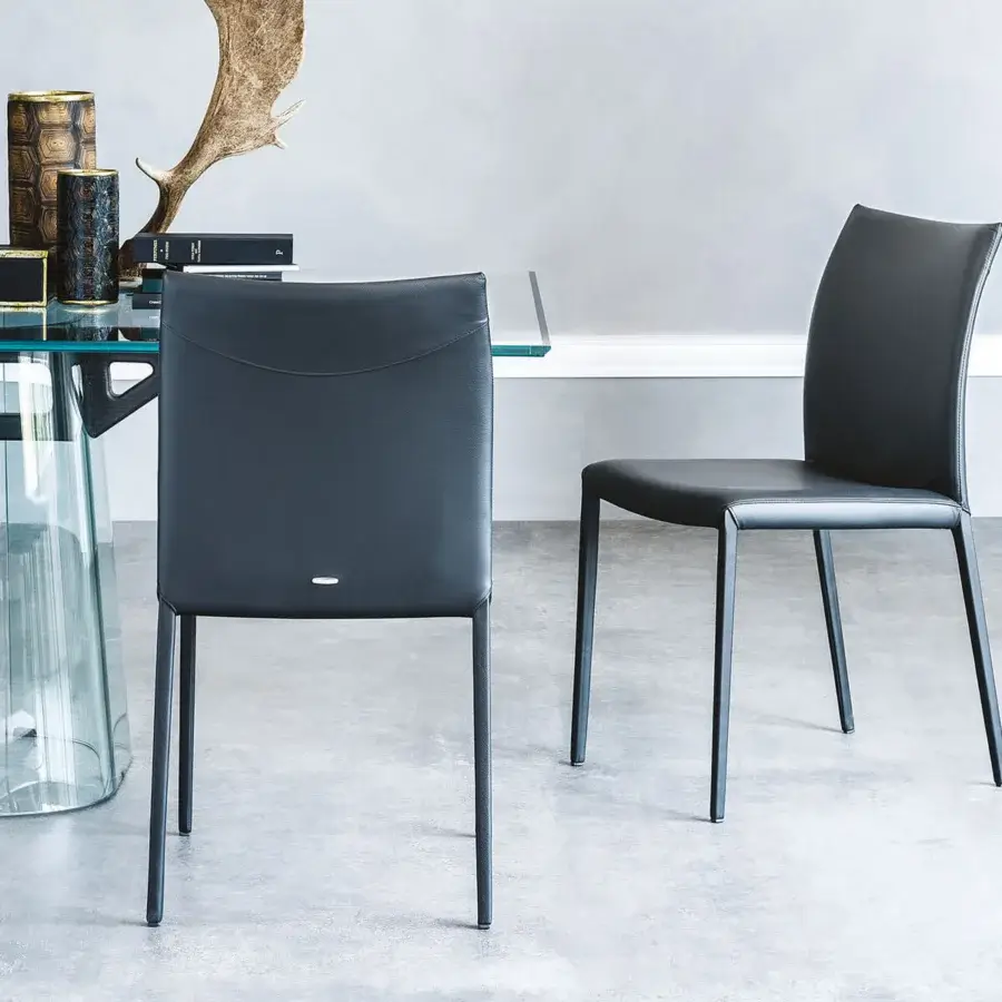 Distinguished Cattelan Italia Norma chair with dark steel frame and matte dark synthetic leather upholstery crafted in Italy
