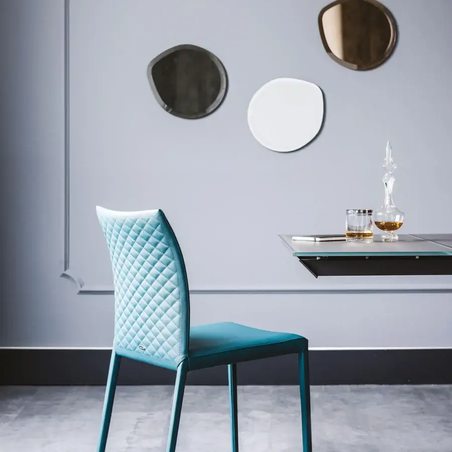 Distinctive Cattelan Italia Norma chair with turquoise synthetic leather and quilted diamond pattern backrest