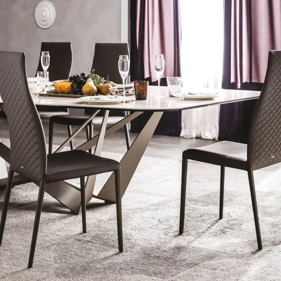 Sophisticated Cattelan Italia Norma chair with quilted dark brown synthetic leather and slender steel legs