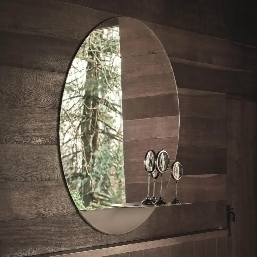 Elegant Ditre Italia Eric mirror with essential oval silhouette and neutral toned metal frame with shelf