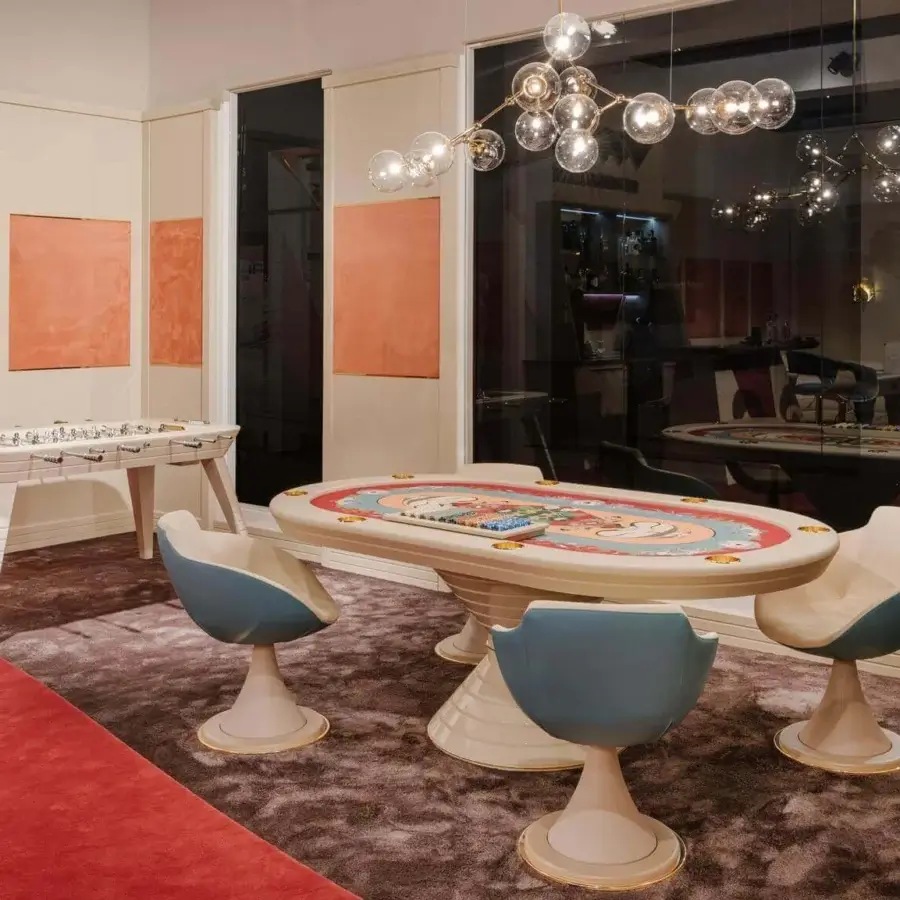 Distinguished Vismara Vegas poker table with oval shape and Soft Touch lacquered edge in creamy off-white with colorful tabletop design