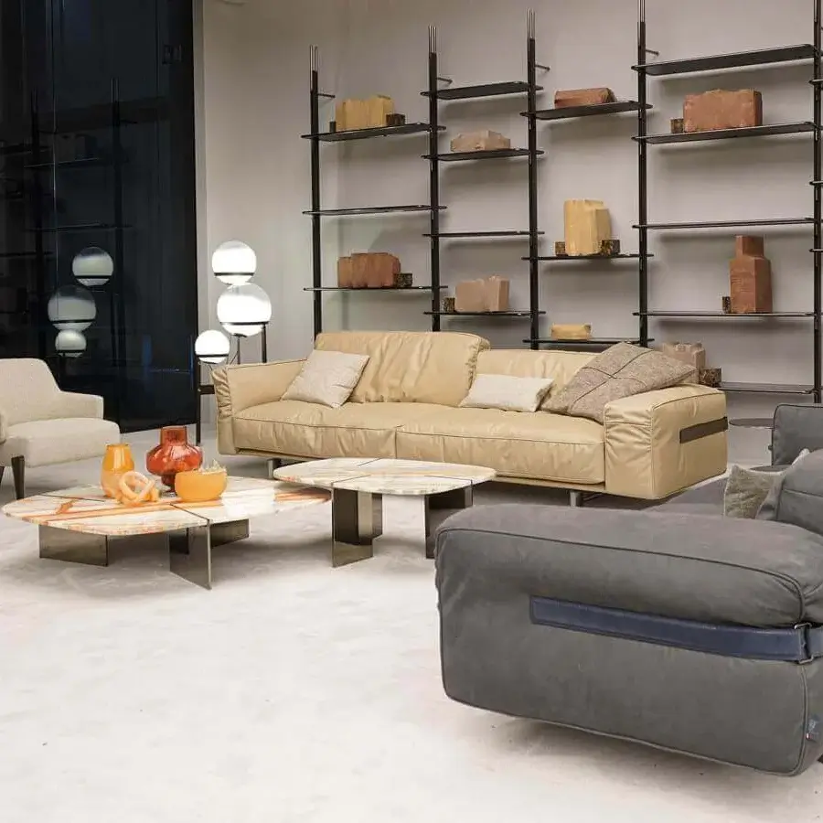 Distinguished Arketipo Close to Me sofa with billowy cushions, wraparound leather straps and elliptical feet crafted in contemporary grey