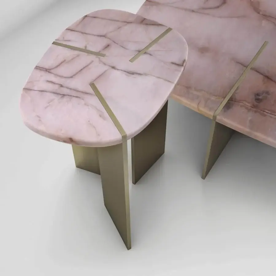 Distinguished Arketipo Rumors coffee table with light pink marble-like top and intersecting matte taupe metal blades crafted with geometric brass accents