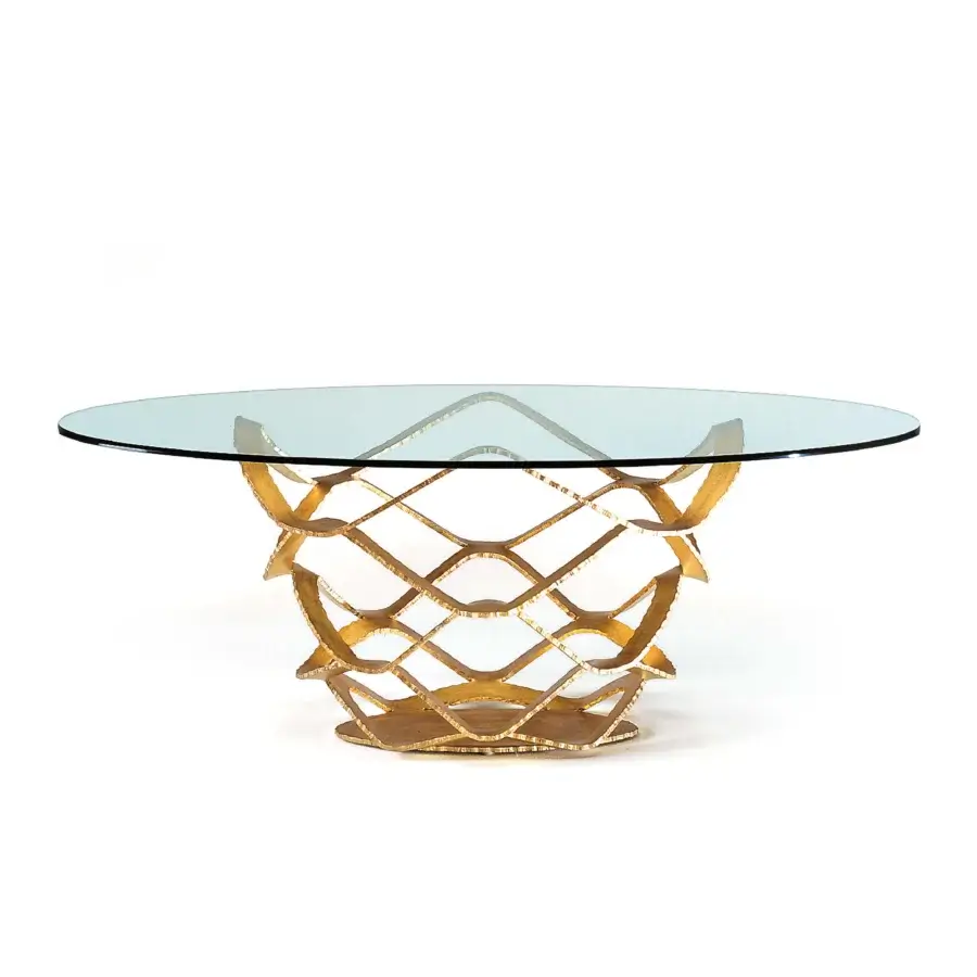 Distinctive Reflex Neolitico table with transparent glass top and forged iron base in luxurious gold leaf finish