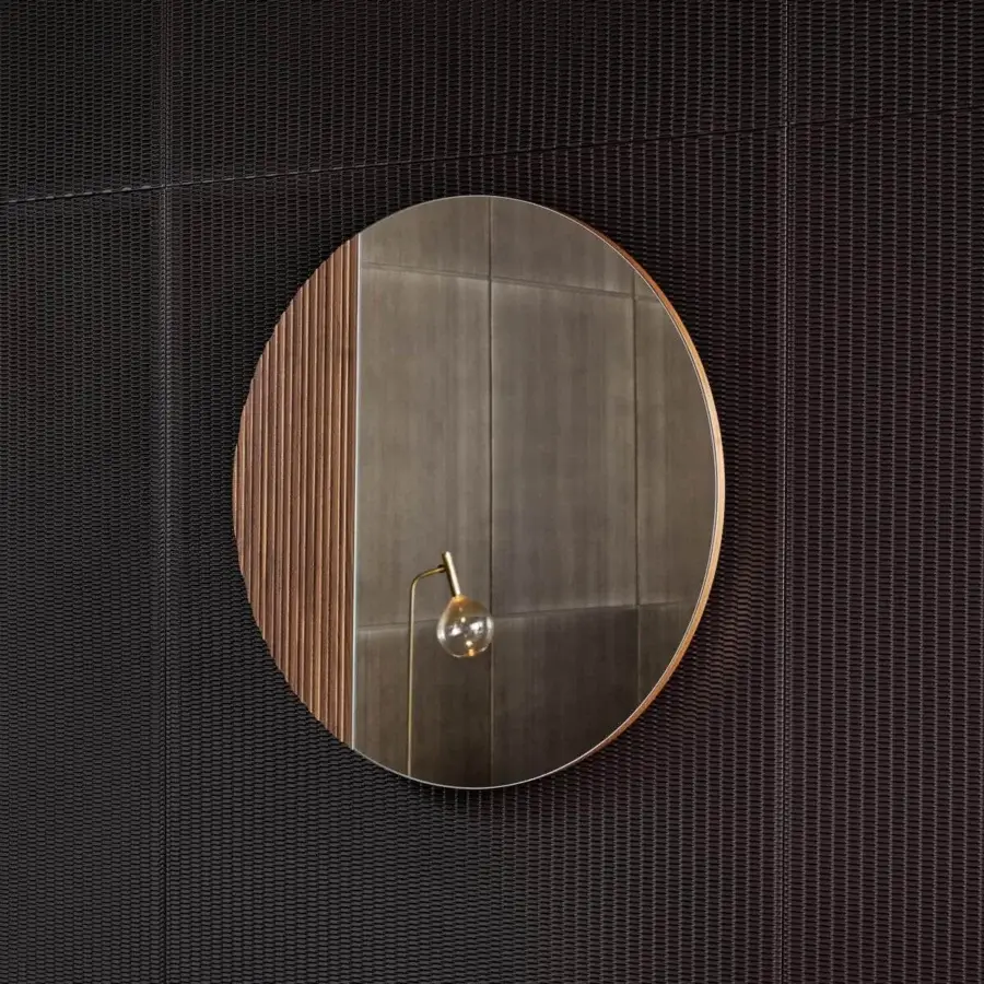 Exceptional Bonaldo Musa mirror with ribbed Canaletto Walnut wood and gold-toned metal arm supporting a clear glass lightbulb
