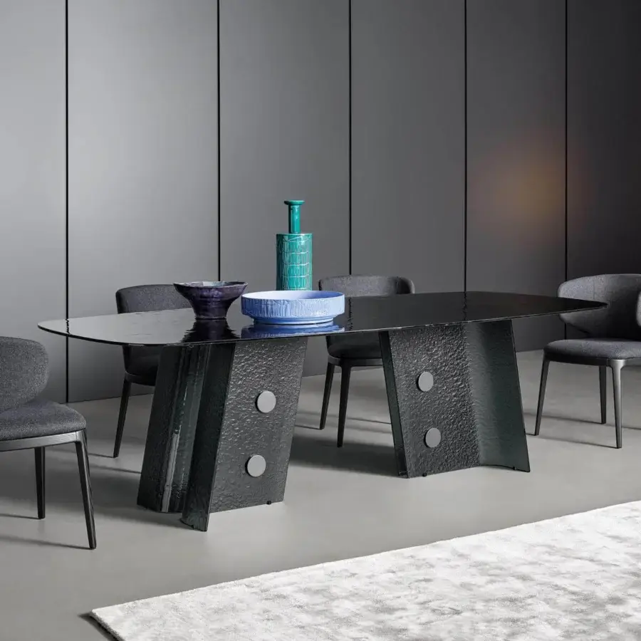 Elegant Bonaldo Botón table with smoked tempered cast glass top and lead plus metal base inserts in glossy hue