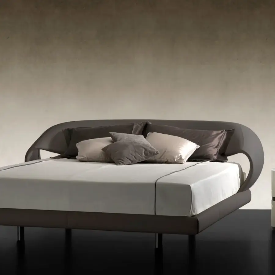 Superior Reflex Nuvola bed presents a curved headboard and sides upholstered in dark brown fabric with a matte finish and sleek black metal legs