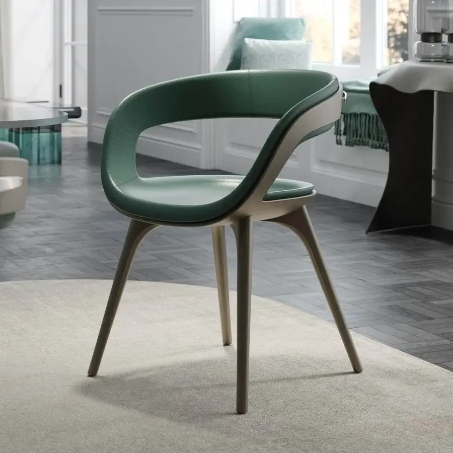 Elegant Reflex Nido armchair with smooth green textile upholstery and light-toned wood tapered legs