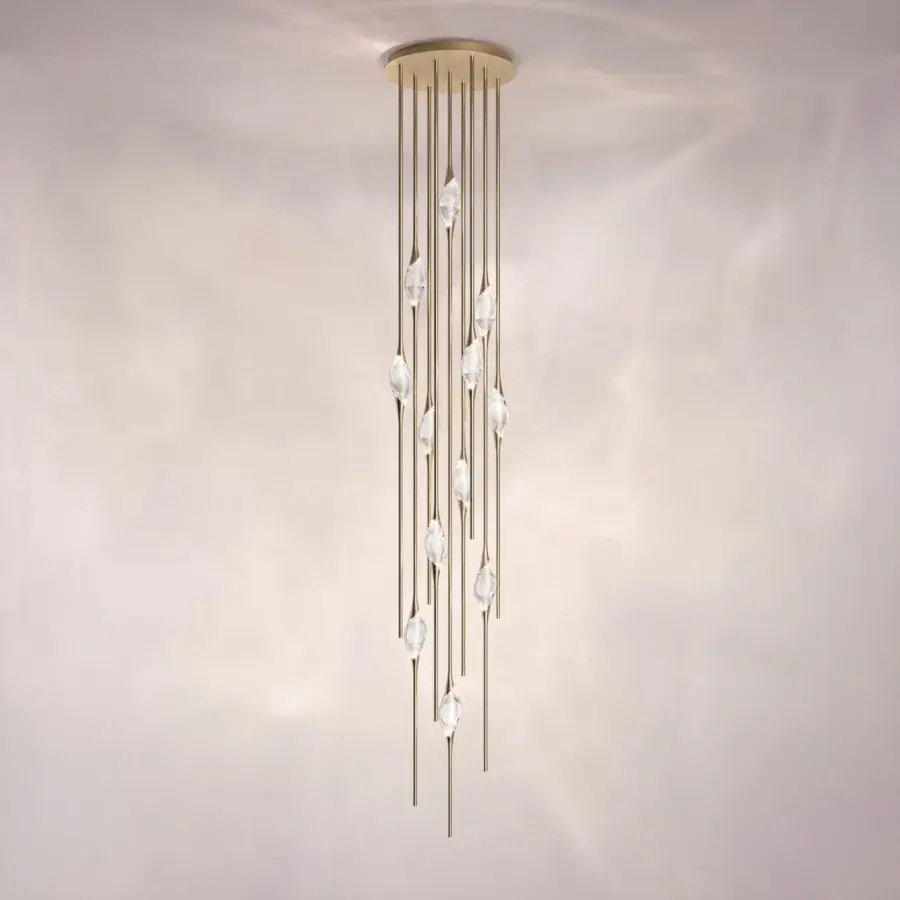 Superior Il Pezzo 12 Cluster suspension lamp with clearest crystal suspended from refined brass stems and satin brass casting rings