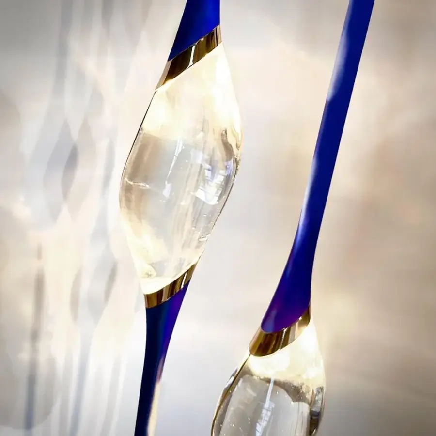 Exclusive Il Pezzo 12 floor lamp with rotating light sources, blue glass and gold-toned metal built with a marble base and high gloss finish
