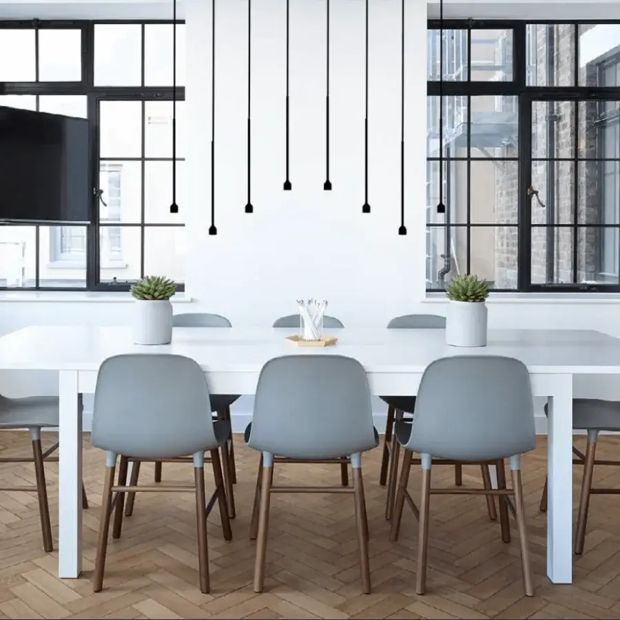 Superior Penta Hail suspension lamp with a minimalist black metal bell and slender cord for directional light