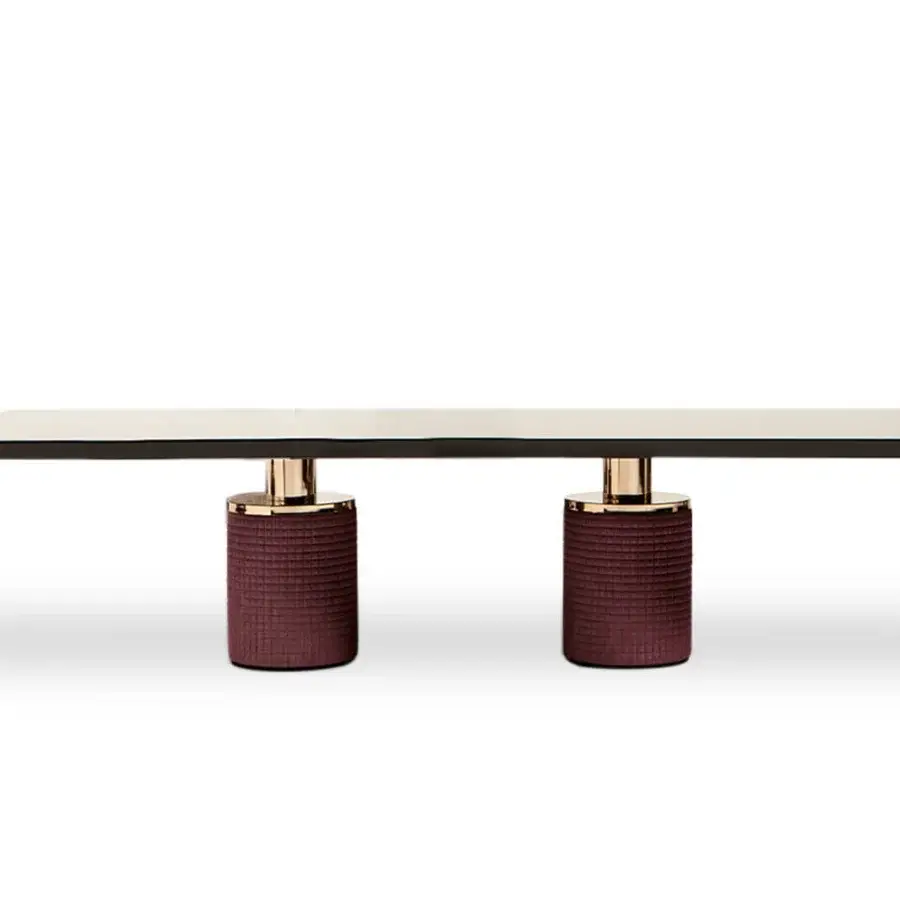 Elegant Costantini Pietro Charlie table with light surface, dark edge, textured reddish-brown legs and gold detailing