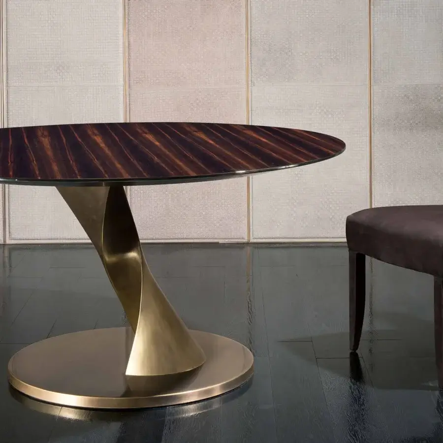 Elegant Rugiano Zoe table with refined Emperador dark marble and swirling brass-like metal base