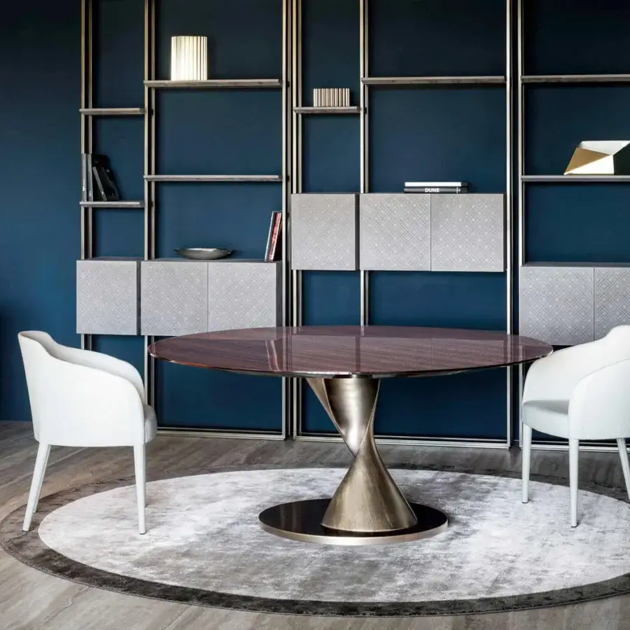 Superior Rugiano Zoe table with Emperador dark marble top and twisting polished aluminum with champagne-silver leather base, exhibiting a high-gloss finish