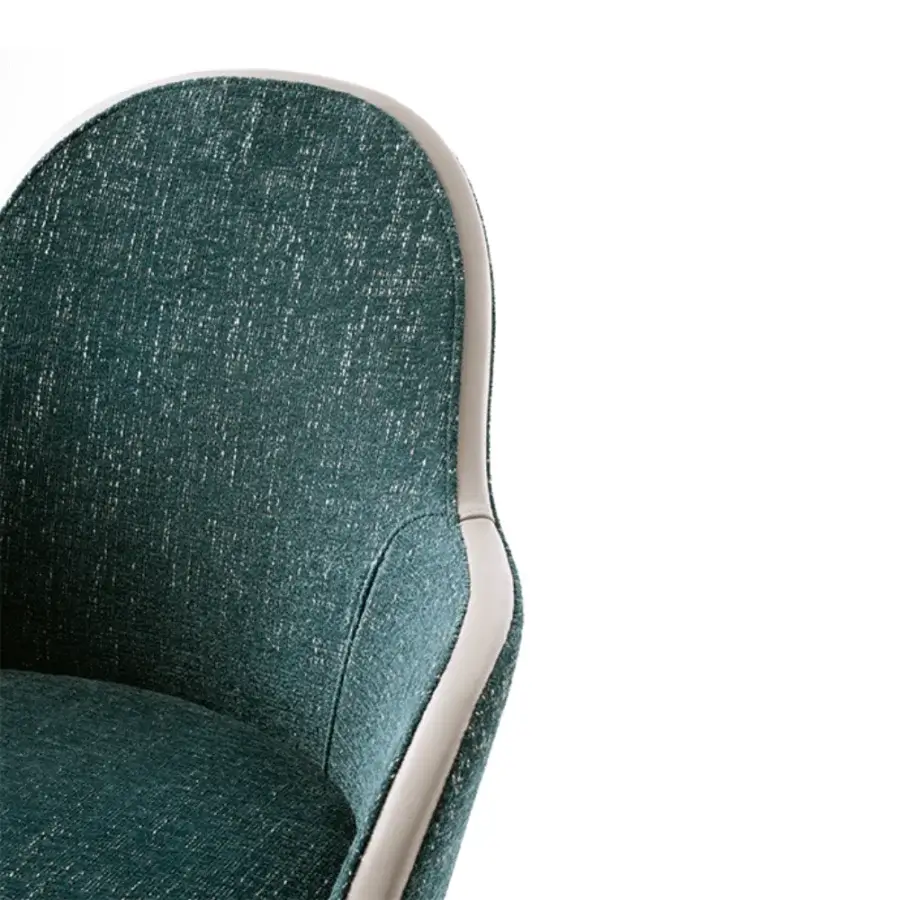 Elegant Giorgetti Lunaria armchair crafted in teal textile with ash wood legs embodying sophistication