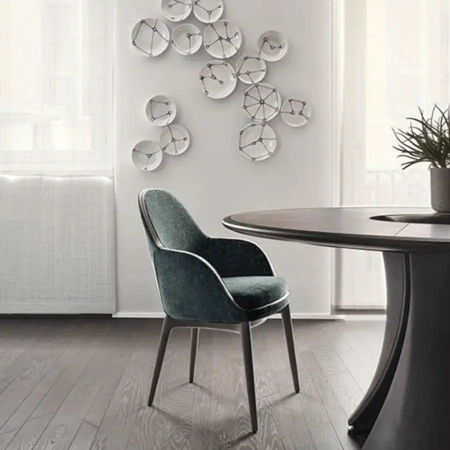 Distinguished Giorgetti Lunaria armchair upholstered in textured dark greenish-blue collectible textile with dark finished ash wood legs